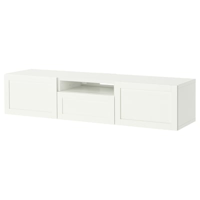 A white BESTÅ tv bench with minimalist design, featuring a central open compartment and two closed sections for storage.