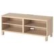 Light oak ikea BESTÅ tv bench with 3 open shelves.