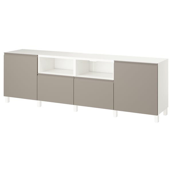 A BESTÅ tv bench in white and beige, offering ample storage with adjustable shelves and soft-closing drawers.