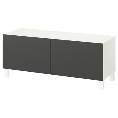 An ikea BESTÅ tv stand. It is white with gray doors and adjustable shelves. The modern design has soft-close doors and cable management.
