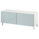 A BESTÅ tv bench in white with light grey doors. It has a modern, rectangular shape with clean lines and a sleek design.