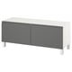 A white and gray BESTÅ tv bench with two doors and adjustable shelves, featuring a modern design and metal legs.