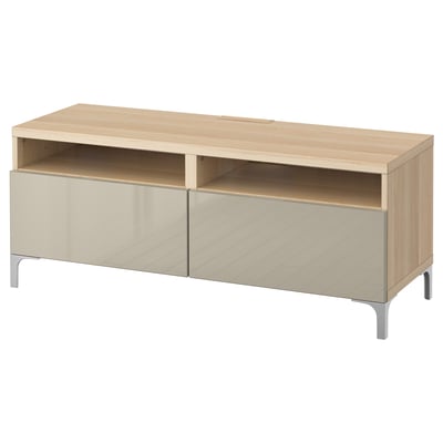 The BESTÅ tv bench in a light wood finish with two cream drawers and metal legs. It offers spacious storage and cable management.
