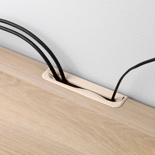 Tv bench with cable management. Rear cable outlets, adjustable drawer runners, and wall fastener for safety. Light wood finish.
