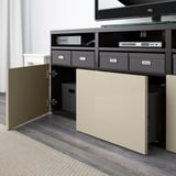 Media console with adjustable shelves, cable management, and soft-close drawers. Wall-mounted tv section holds cables neatly.