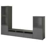 A dark grey BESTÅ tv unit with shelves and cabinets.