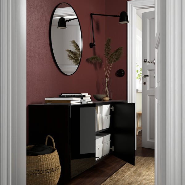 Black BESTÅ cabinet with storage, mirror, and lights