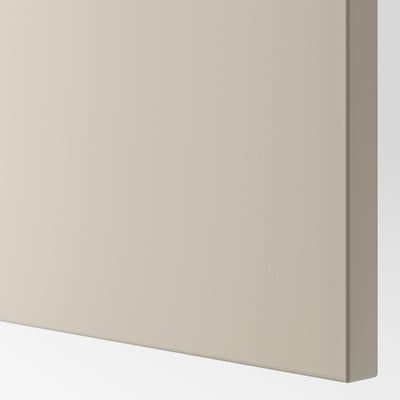 Close-up of smooth, beige BESTÅ cabinet. Sleek, even finish.