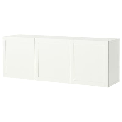 A white BESTÅ wall-mounted cabinet with three doors, offering storage and a modern look.