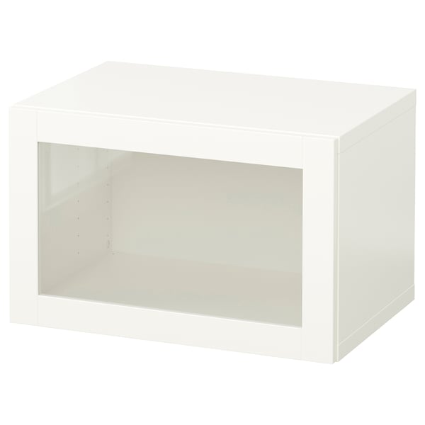 A white BESTÅ storage unit with a glass door on a white background.