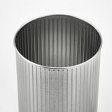 Silver cylindrical trash can with vertical grooves, sleek design, metallic finish.