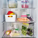 Fridge with BEVARA clips sealing fruits and veggies, keeping produce fresh.