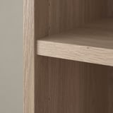 Close-up of BILLY bookcases wooden shelf, showcasing fine grain texture and sturdy craftsmanship.