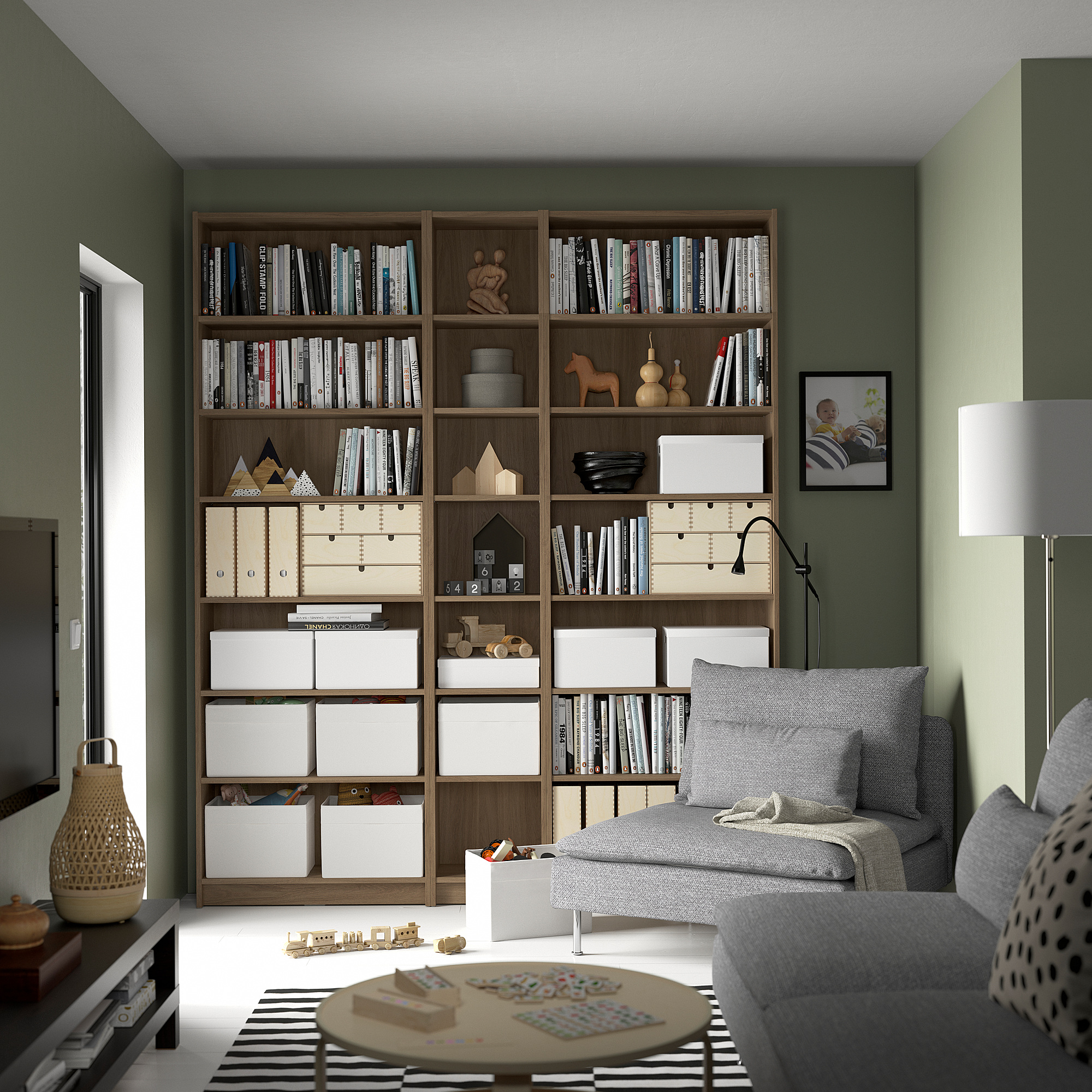 Cozy living room with BILLY bookcase, sofa, puzzle, & lamp.