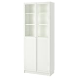A BILLY bookcase in white, featuring glass doors and adjustable shelves, designed for versatile storage.