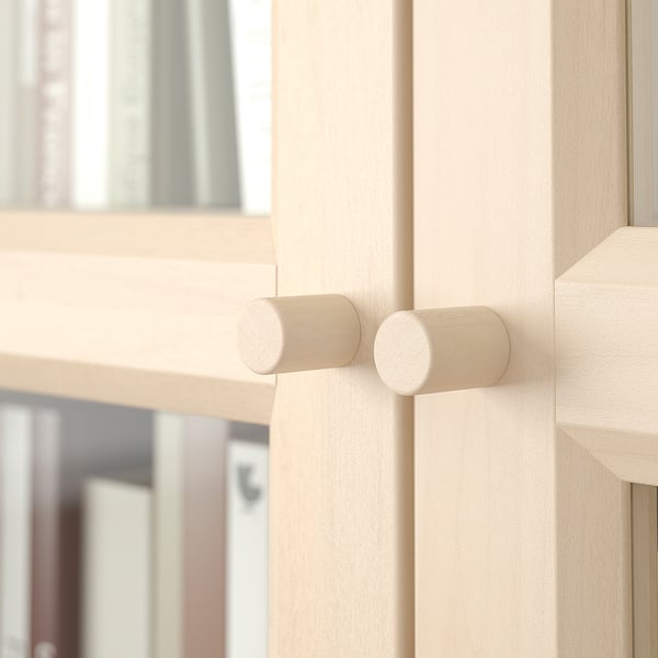 Light wooden knobs on BILLY bookcase, sleek design, natural texture.