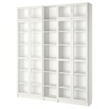 White BILLY bookcase with clear glass doors, adjustable shelves, and minimalist design.