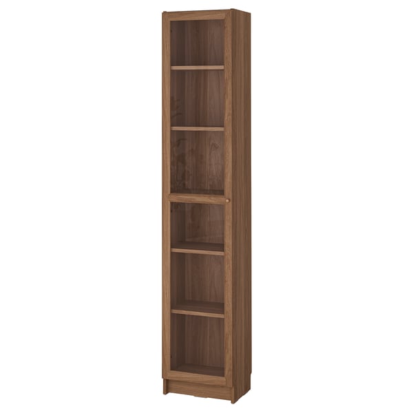A BILLY bookcase, tall and brown, made of wood with multiple shelves for storage.