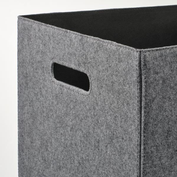A sturdy gray fabric storage box with cut-out handles, designed for kallax shelving. Feels soft and high-quality, perfect for organizing items neatly.