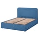 Blue blåfjärlet bed with upholstered headboard, wooden slats, and hidden storage.