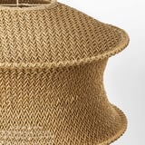 Handwoven pendant lampshade with intricate paper patterns, emitting warm light.