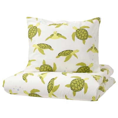 White bedding set with green sea turtle print, made of soft cotton.