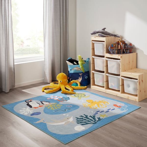 BLÅVINGAD blue ocean rug on wooden floor, soft & recycled.