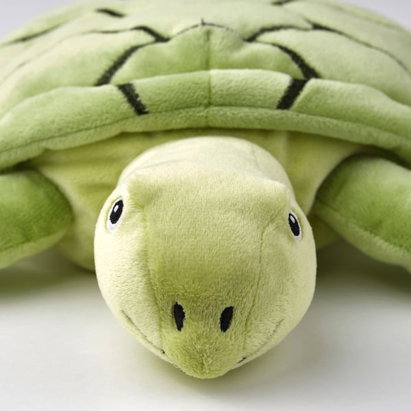 Stuffed sea turtle toy; soft, green, detailed shell, friendly face; eco-friendly.