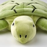 Stuffed sea turtle toy; soft, green, detailed shell, friendly face; eco-friendly.