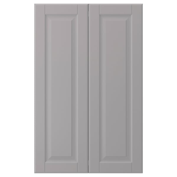 This image shows two light gray cabinet doors with beveled panels, smooth and seamless, made from fiberboard with a polyurethane paint finish.