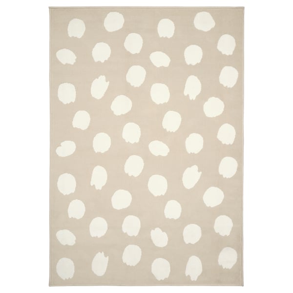 BOGENSE rug, beige with white dots, square shape, playful design.
