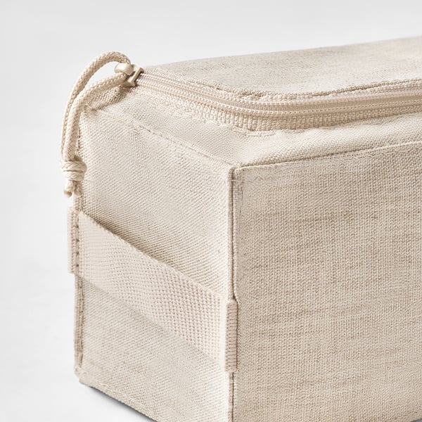 Beige fabric storage box with zipper closure and side handle, showcasing reliable stitching and quality construction.