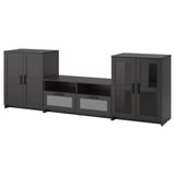 Three-piece BRIMNES tv unit in black; includes open drawers and glass doors, modern design with sleek lines.