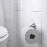 Chrome toilet roll holder with white paper, BROFJÄRDEN series.