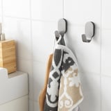 Bathroom hooks with towel; conceal screws, stainless steel for durability.
