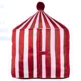 A BUSENKEL circus-themed pillow. Its red and white striped, cone-shaped with a pompom top, made of polyester, and a zipper detail.