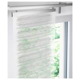 Thin curtain mounted on track, softens light, ideal for layered window solutions.