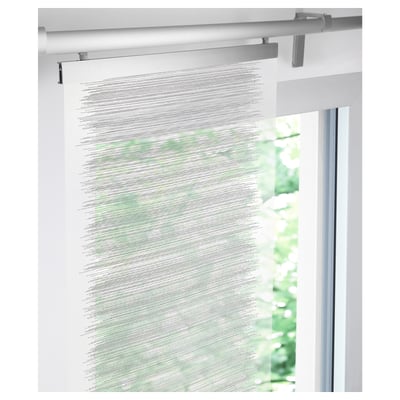 Thin curtain mounted on track, softens light, ideal for layered window solutions.