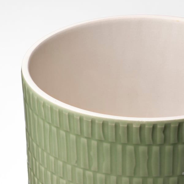 Vase with textured, light green & white, stoneware material, showcasing intricate design.