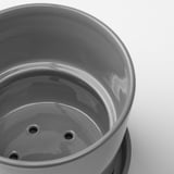 Grey glazed stoneware planter with holes