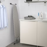 Ironing station with foldable board, side shelf for iron, adjustable height.
