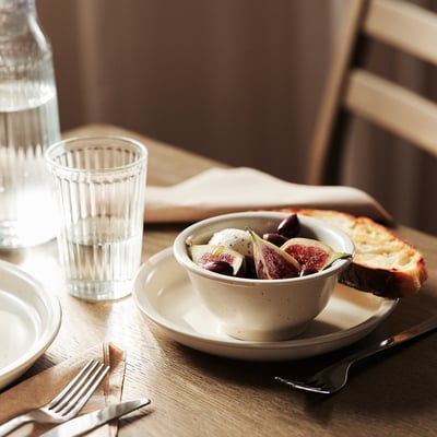 Dagaster white bowl w/ orange specks, stoneware, rounded shape w/ sturdy edge.