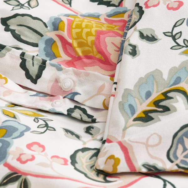 Floral-patterned duvet cover with button closure, showcasing vibrant colors and smooth fabric texture.