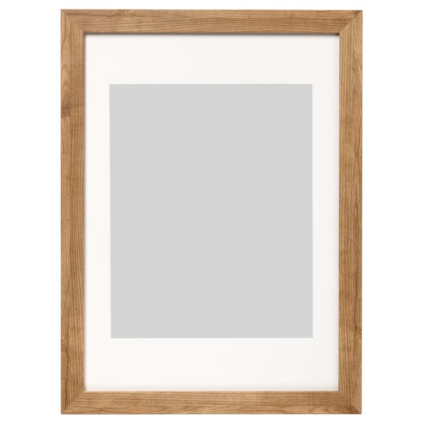 A wooden picture frame named DALSKÄRR, featuring light brown oak finish, rectangular shape, and front plastic protection.