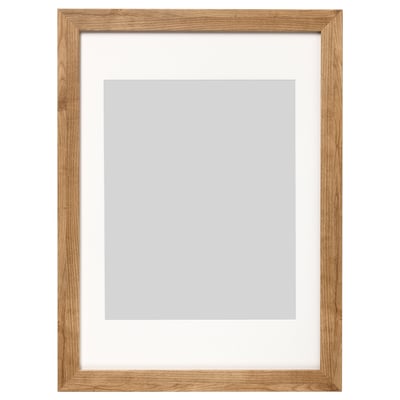 A wooden picture frame named DALSKÄRR, featuring light brown oak finish, rectangular shape, and front plastic protection.