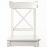 White chair with sleek design, featuring sturdy wooden seat and back, supported by stylish x-shaped metal legs.