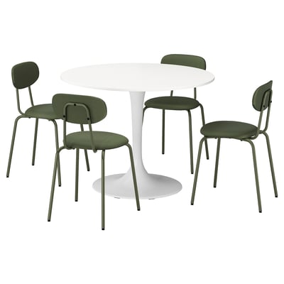 A DOCKSTA dining set with a white round table and four green chairs. The chairs have a metal frame and a curved backrest for comfort.