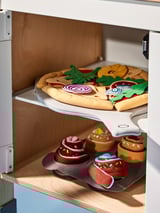 Toy kitchen shelf with colorful fabric oven mitts and plush buns.