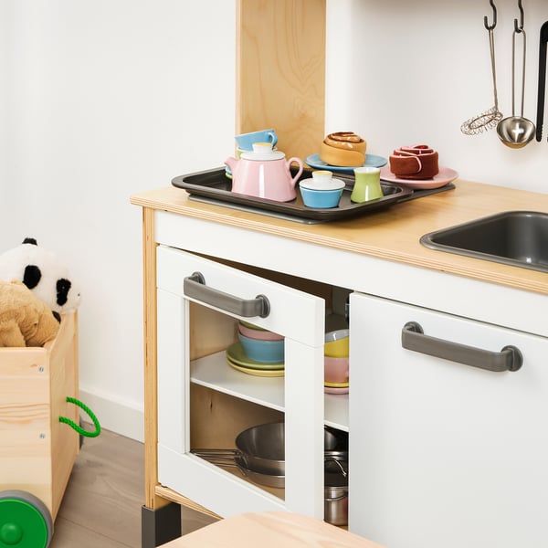 Childrens toy kitchen play set with colorful cups and oven.