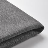 A folded grey fabric, possibly a cushion cover, showcasing its smooth texture and neat stitching.